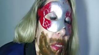 Kinky masked Blonde shitting and pissing in pantyhose and then smears that scat on face