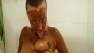 Busty teen scat girl poops and smears shit all over her body and face