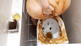 Dirty scat girl playing with collected and fresh shit in the toilet