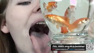 Pretty hungry girl swallows innocent fish - Vore